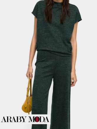 طقم متناسق باللون الاخضر الداكن حتى يعبر عن اطلالة شتاء دافئة