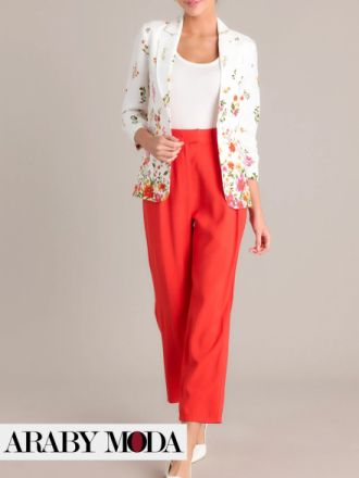 A vibrant winter work look with a white blazer with a floral print and bright pants