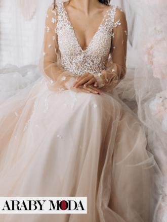 Pink winter wedding dress with layers for a soft feminine image