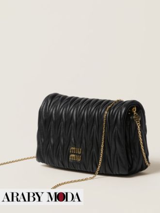 Black Miu Miu bag with embroidered details that express sophistication