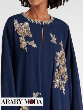 Carolina Herrera Kaftan decorated with flowers and crystals on the neck