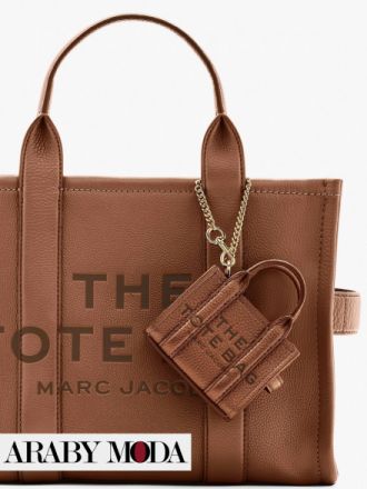 Attach the Marc Jacobs The Tote Bag Mini Charm to your bag