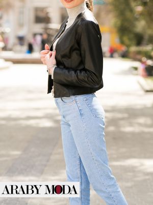 A short black leather jacket with light jeans and a soft sweater