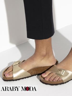 Fashion and comfort in these gold Birkenstock slides