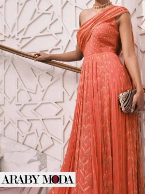Women with warm skin tone wear a coral color dress