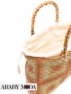 Close-up view of the inner pocket and bamboo handle of the Twin-Set Crochet Bag