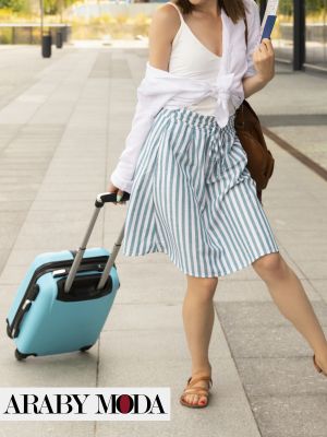 Airport outfit for honeymoon, contain skirt, t-shirt, and sweater to protect you from the cold of airport
