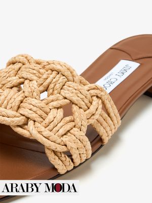 Jimmy Choo straw slippers as a honeymoon travel outfit choice