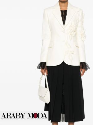 Black skirt with a white blazer decorated with roses