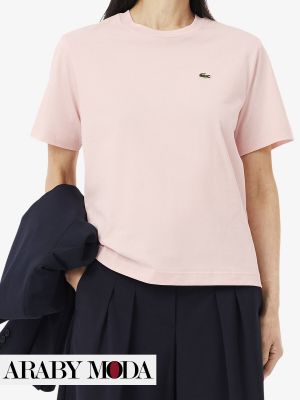 Pink Lacoste T-shirt with small logo is base for summer outfit with old-money spirit
