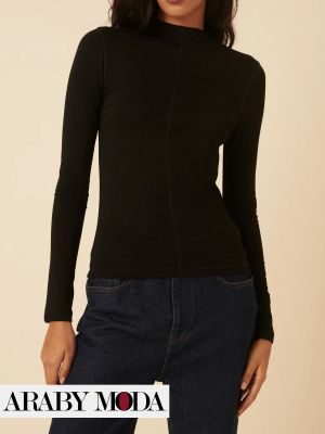 A long-sleeved black blouse is a winter fashion staple A long-sleeved black blouse is a winter fashion staple