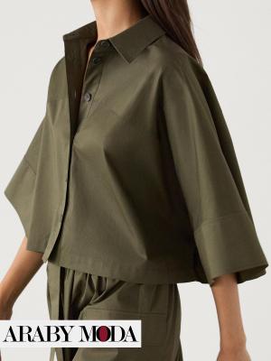 A loose khaki Massimo Dutti shirt coordinated with a Massimo Dutti skirt