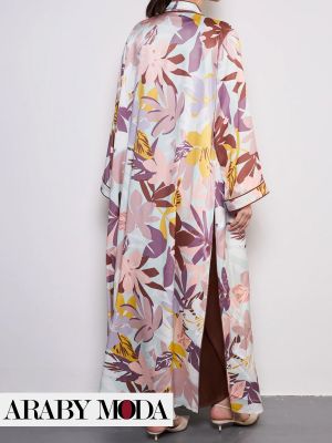 Colorful abaya with an autumn leaf print creates a rich, philosophical outfit