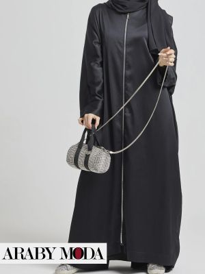 An abaya that adheres to traditional black with a youthful spirit