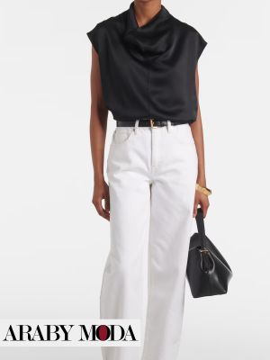 Simple elegant outfit with white jeans and a black satin blouse