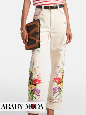 High-waisted, straight-leg white jeans with floral embroidery