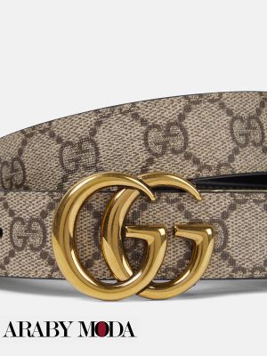 Complete the elegant outfit with a Gucci belt with monogram print and logo buckle