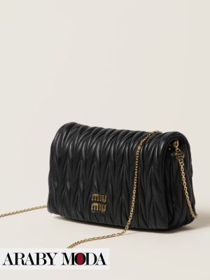Black Miu Miu bag with embroidered details that express sophistication