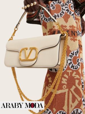 White bag from Valentino brand to complete a very soft fall and winter image