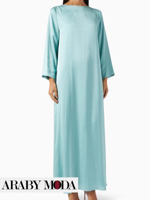 A blue dress with a blue abaya for a matched look during Eid Al-Adha