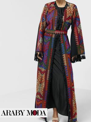 Luxurious abaya with traditional oriental embroidery with a black dress