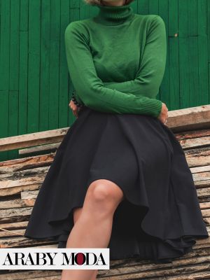 Green blouse with a high neck for a youthful winter image