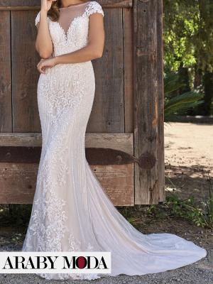 Luxurious soft wedding dress made of embroidered lace fabrics