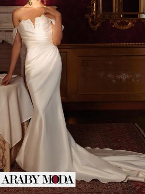 Mikado bridal dress with pleats and a pointed neck for a luxurious royal day