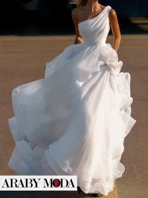 White organza wedding dress with a shoulder and fluffy with a long tail